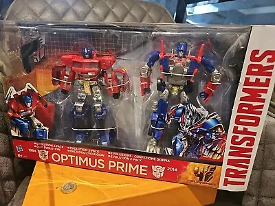 Buy NEW Hasbro Transformers Optimus Prime Evolution 2 Pack Set Toys R Us NIB AOE  • 64.99£